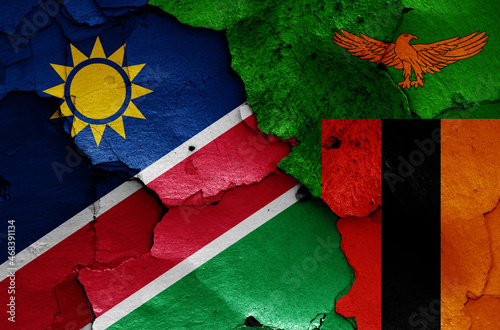flags of Namibia and Zambia painted on cracked wall