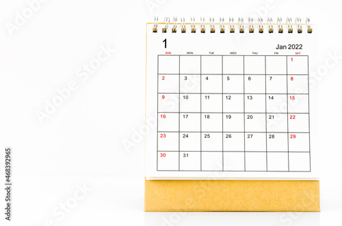 January 2022 desk calendar on wooden table. © gamjai