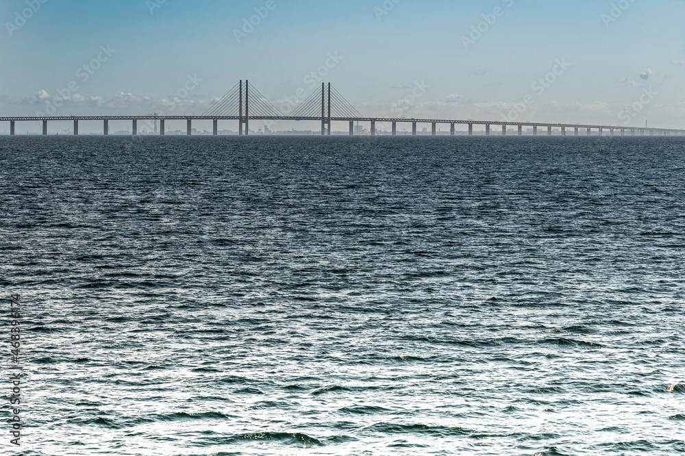 Oresund - the Öresund bridge in the sea between Copenhagen and Malmo on a sunny day from the seaside