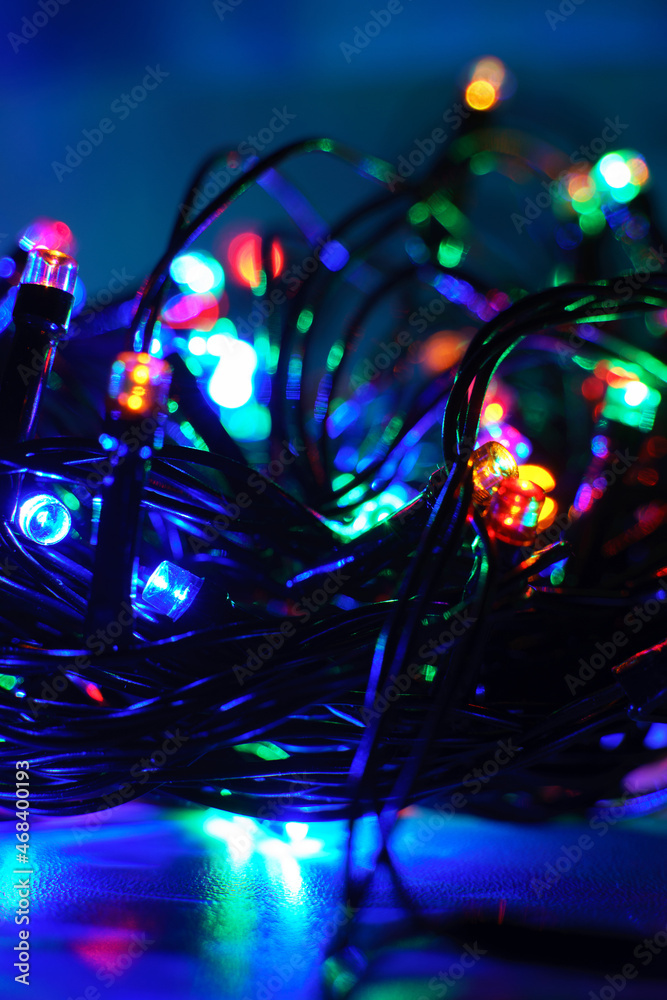 Lights of a lit new year garland at night Lights of a lit new year garland at night