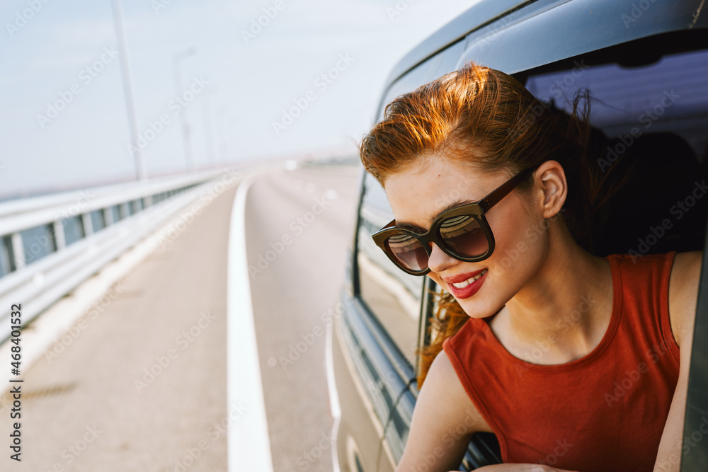 woman looking out of car window wearing sunglasses travel lifestyle woman looking out of car window wearing sunglasses travel lifestyle