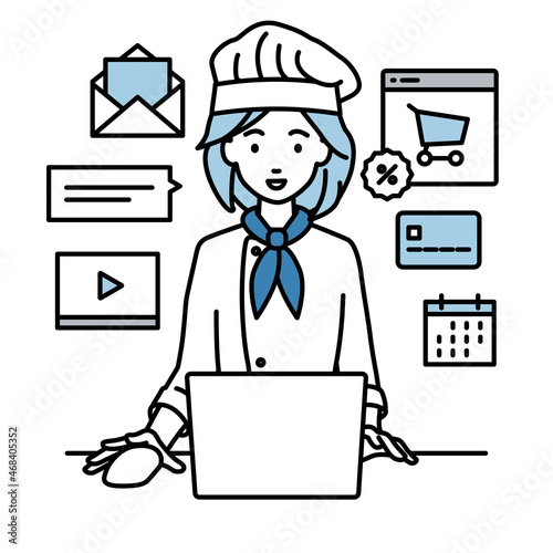 デスクで座ってPCでネットショップやマーケティングの仕事をしている調理師の女性