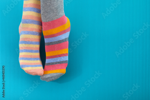 Photos Odd Socks Day. Day lost socks, lonely socks on blue background.