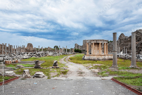 side tyche temple. The temple built by the Side people inside the Agora for the god who rules the sky and the stars. cloudy blue sky. no people. selective focus ruins. photo