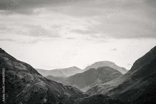 A monochrome landscape photograph of the southern fells of Buttermere Valley in The Lake District, Cumbria.