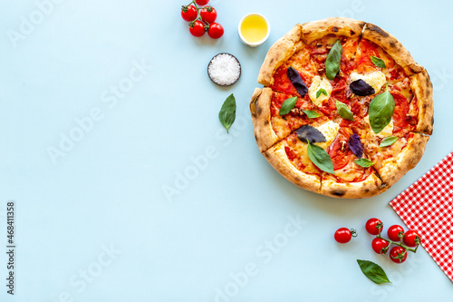 Food ingredients for cooking pizza - tomatoes cheese and basil