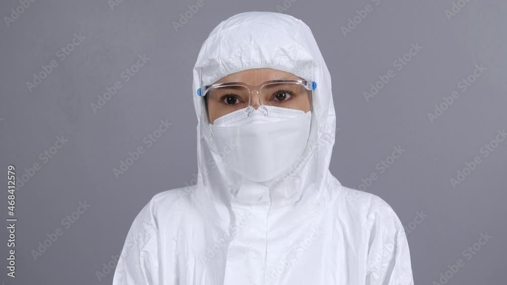 female doctor in protective PPE suit wearing face mask and face shield protection from coronavirus(covid-19) pandemic