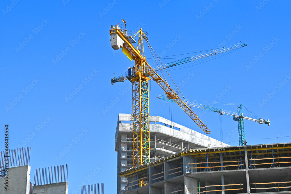 Crane and highrise construction site