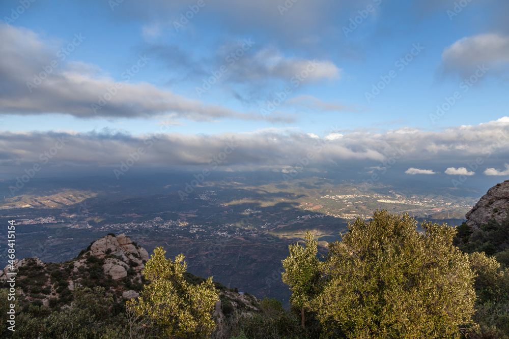 Picturesque landscape with mountains. Landscape and beautiful sunset on Montserrat mountain. Rock formations and cliffs in the Catalan Natural Park of Montserrat. Barcelona, Catalonia, Spain