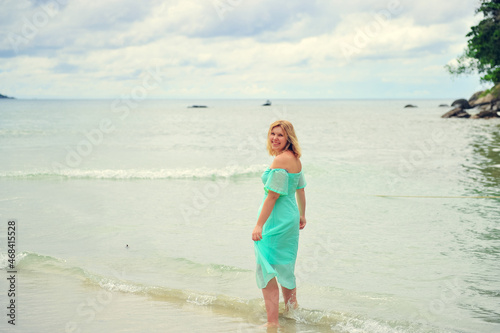 woman walking on the beach © Anastasia