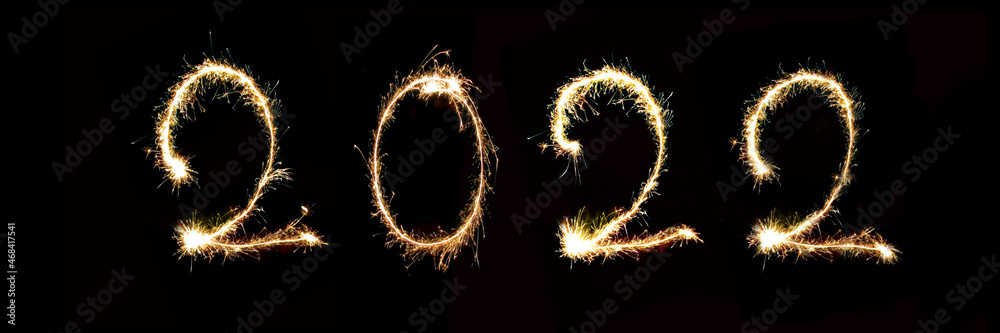 2022 written with sparkler firework, new year header or web banner