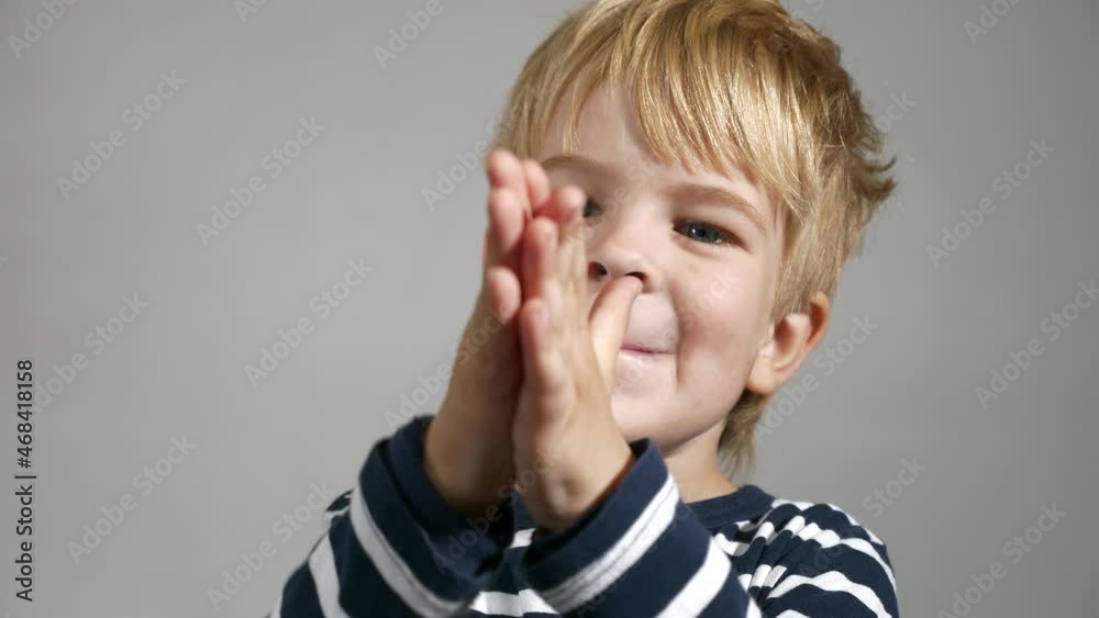 Rubbing Hands Gesture. Happy Child Emotions. Portrait Cute Little Boy. Glad Smiling Face. Joyful Kid against White Wall Background. 2x Slow motion 60fps 4K Rubbing Hands Gesture. Happy Child Emotions. Portrait Cute Little Boy. Glad Smiling Face. Joyful Kid against White Wall Background. 2x Slow motion 60fps 4K