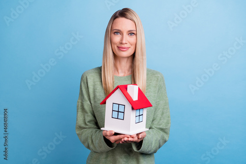 Photo of mature lady hold home buy new real estate property safe isolated over blue color background