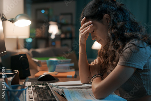 Depressed stressed woman sitting at desk