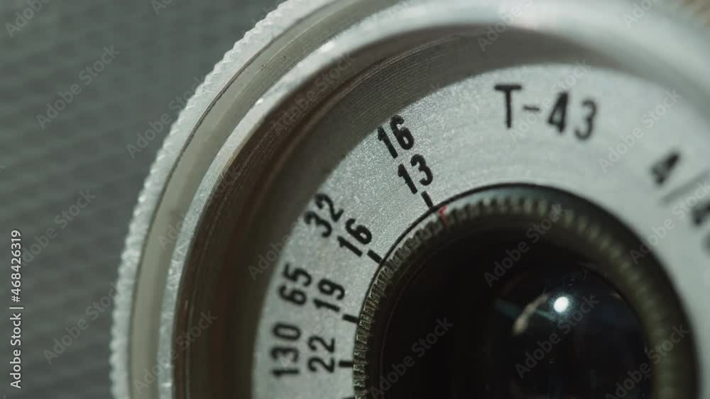 Zooming old camera close-up. Antique photo equipment, vintage old-fashioned camera lens macro shooting. Zooming old camera close-up. Antique photo equipment, vintage old-fashioned camera lens macro shooting.