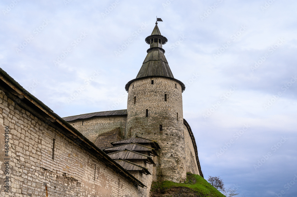 Square round tower. kremlin towers. Pskov, fortress wall. A beautiful evening.