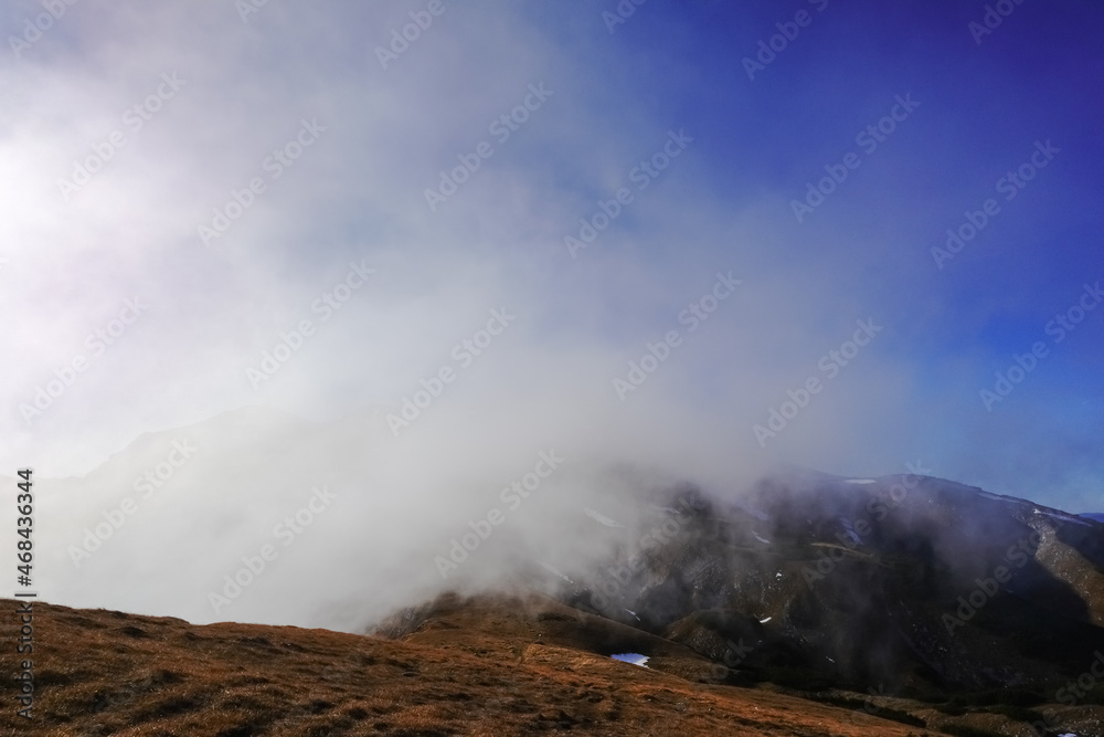 strong current from a fog from the valley on a mountain