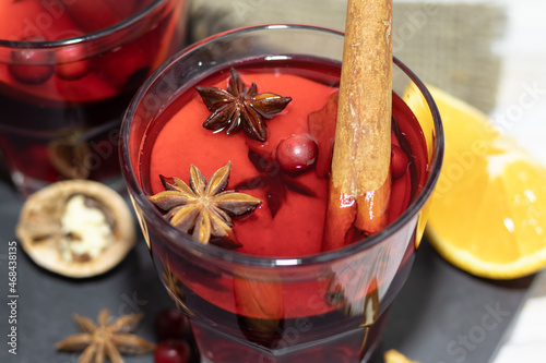 christmas drink hot mulled wine in a glass, anise,apple,cinnamon,cranberry,walnut