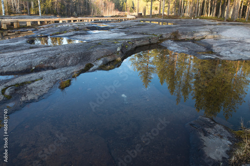White Sea petroglyphs, plateau in the forest, rock water travel. Petroglyphs in Karelia, Belomorsk district, Russia.