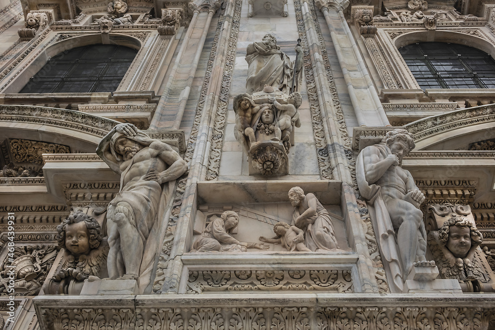 Architectural fragment of Milan Cathedral (Duomo di Milano, 1386), dedicated to St Mary of the Nativity (Santa Maria Nascente), with Gothic and Lombard Romanesque style. Milan, Italy.