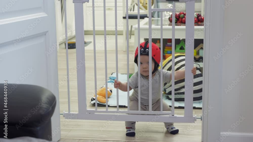 Childproofing a house, doorway with safety baby gates to keep curious