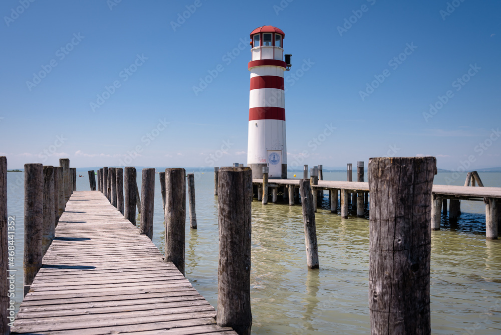 Wooden pier and lighthouse at Lake Neusiedl, Podersdorf am See, Burgenland, Austria