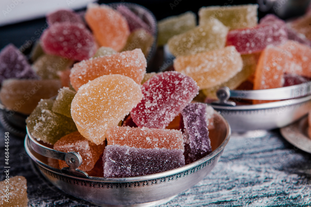 Dessert marmalade in the form of lemon and orange slices. The sweetness of jelly candy. Dessert marmalade in the form of lemon and orange slices. The sweetness of jelly candy.