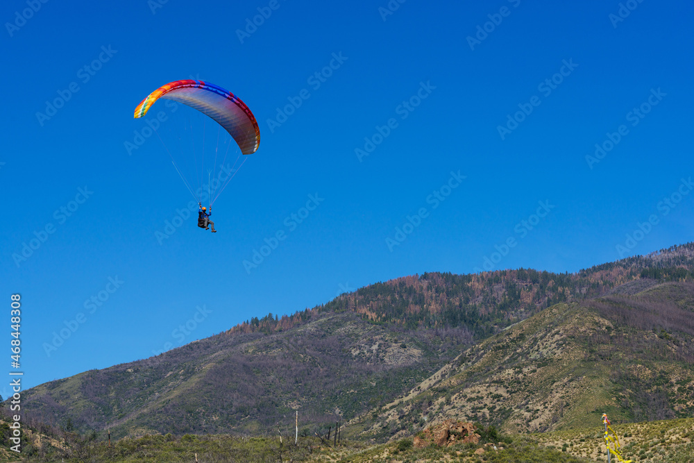 Paragliding Pilot Flying a Paraglider Paragliding Pilot Flying a Paraglider