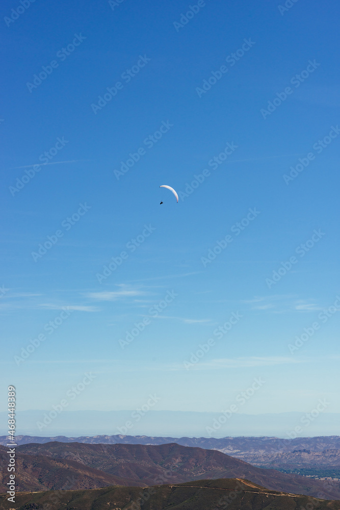 Paragliding Pilot Flying a Paraglider
