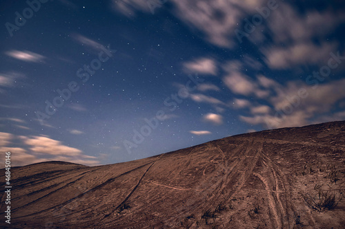 Abstract landscape with sandy dune at night