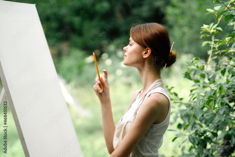 Cheerful woman artist nature easel creative art Cheerful woman artist nature easel creative art