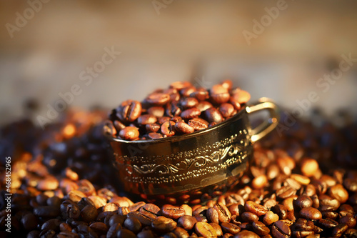 Selective focus. Coffee beans in a cup.