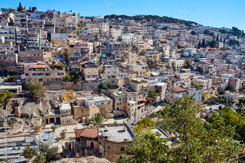 view from city of David on Silwan or Siloam is arab neighborhood in East Jerusalem, on outskirts of Old City of Jerusalem, Israel © Kira