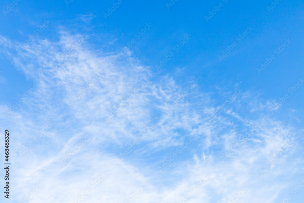 White cirrocumulus clouds in blue sky on a daytime