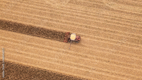 Overhead drone image of combine harvesting.