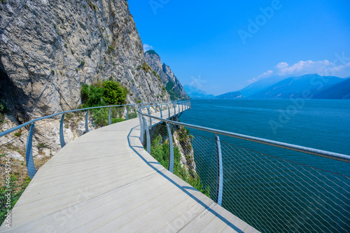  Ciclopista del Garda  - Bicycle road and foot path over Garda lake with beautiful landscape scenery at Limone Sul Garda - travel destination in Brescia  Italy