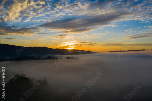 Sunrise over a tropical cloud forest in the Andes of Ecuador which is covered in fog early in the morning