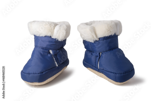 Baby winter boots with fur isolated on white background. New blue fluffy boots for newborn boy or girl