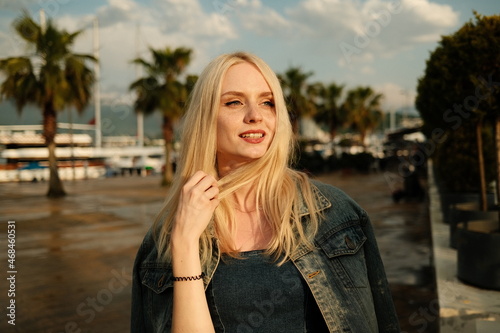 Portrait of Beautiful young blonde girl at sunset in Batumi