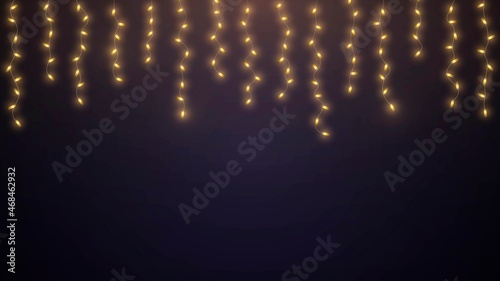 Hanging glowing garlands with golden light bulbs on dark background