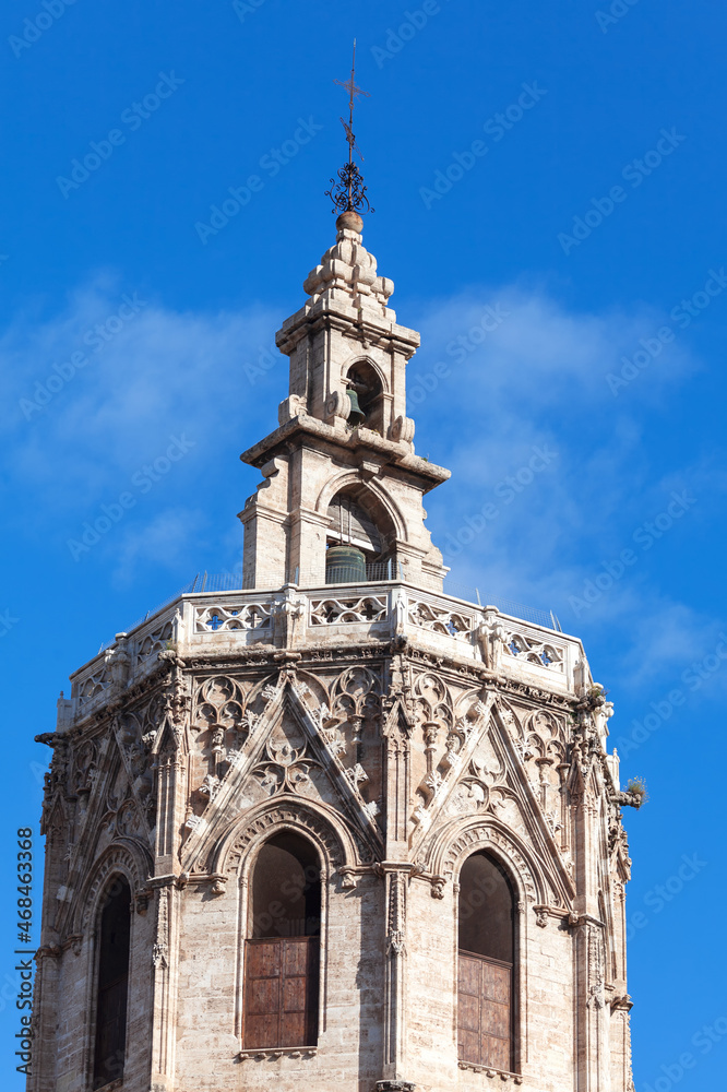 Steeple of gothic church . Belfry of medieval cathedral . Christian cross on the church top 