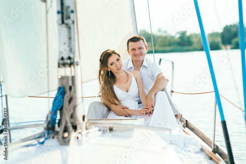 young couple guy and girl on a sailing yacht © omelnickiy