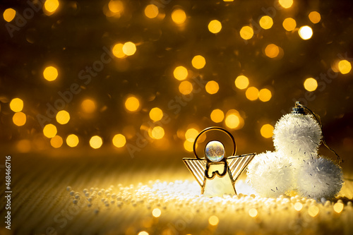 Angel toy on a Christmas background .Christmas card. Christmas decoration.