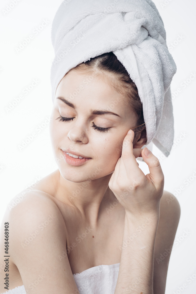 woman after shower with towel on head posing skin care woman after shower with towel on head posing skin care