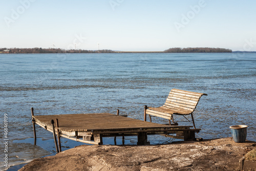 wooden bench on an old pier on a frozen lake in Dalarna  Sweden