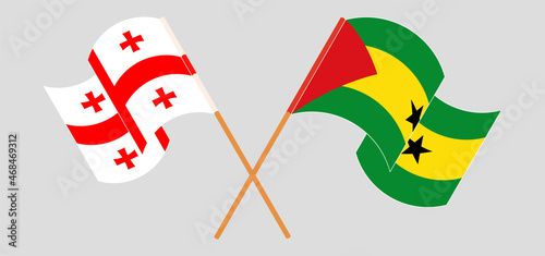 Crossed and waving flags of Georgia and Sao Tome and Principe