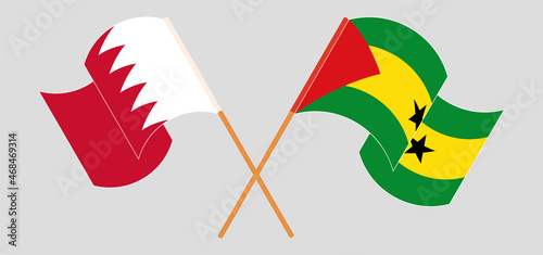 Crossed and waving flags of Bahrain and Sao Tome and Principe