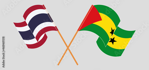 Crossed and waving flags of Thailand and Sao Tome and Principe