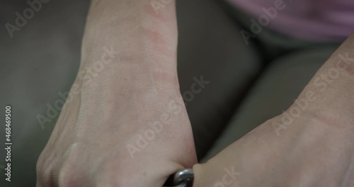 Tortured woman hands. A woman show her hands after a chain torture in the room. photo
