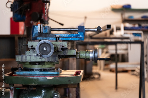 Clamp and the Vertical Drill Inside a Factory
